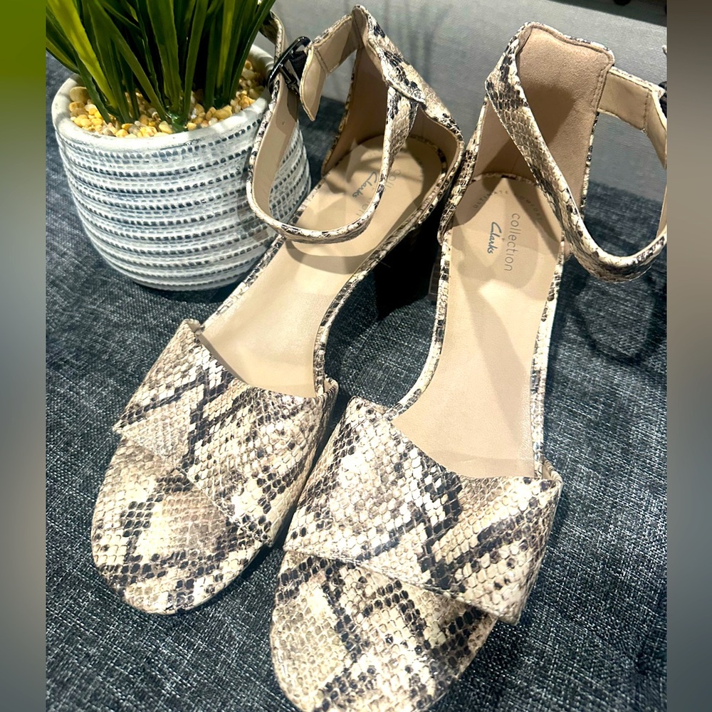 Beautiful Clark snakeskin, kitten heal ankle buckle sandals.